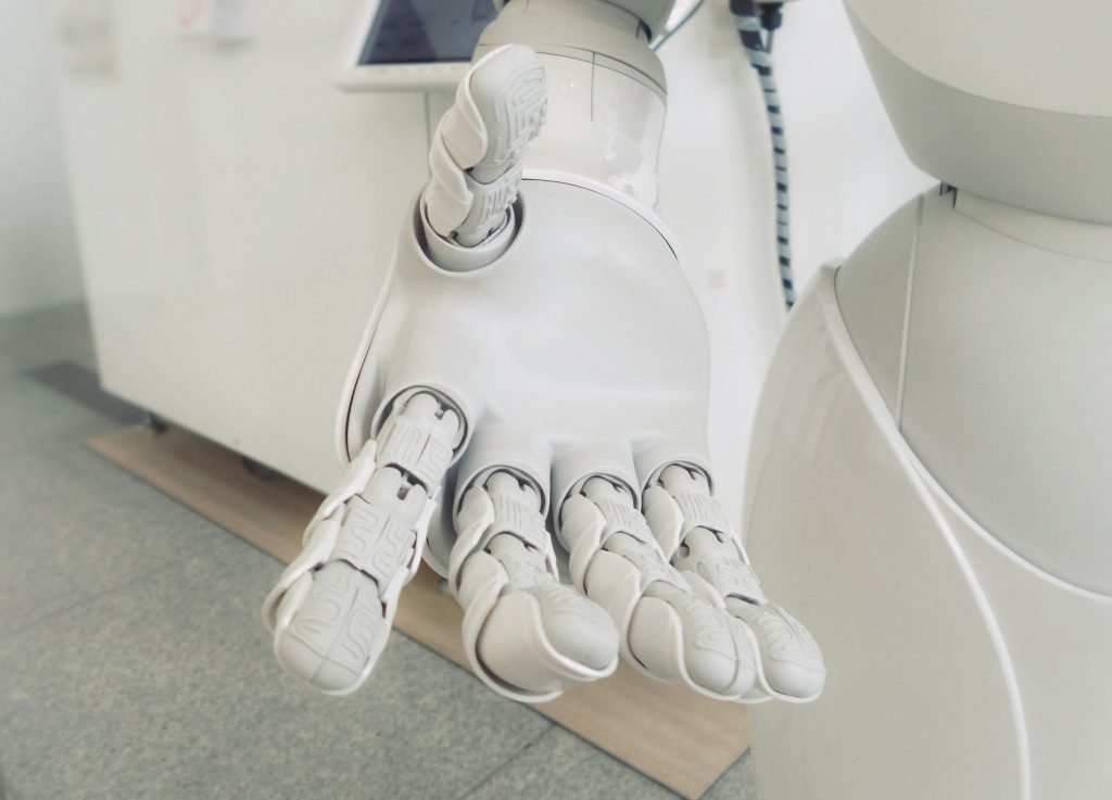 Robot holding out a hand illustrating a trends report from Snowflake that suggests AI is revolutionising the marketing strategy of companies and changing the landscape.
